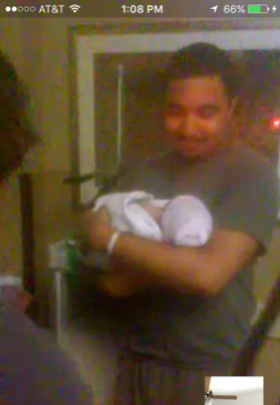 Daddy holding baby for the first time